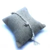 Bracciale con Pepite Martellate Tonde e 3 Campanellini Bianchi