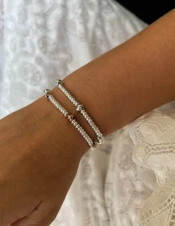 Bracciale Rondelle e Nodi COLORE ARGENTO Bianco QUANTITÀ NODI 3 nodi
